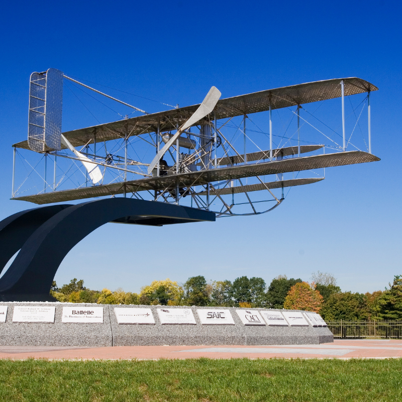 A plane used by the Wright Brothers on display in front of Wright-Patterson Air Force Base.